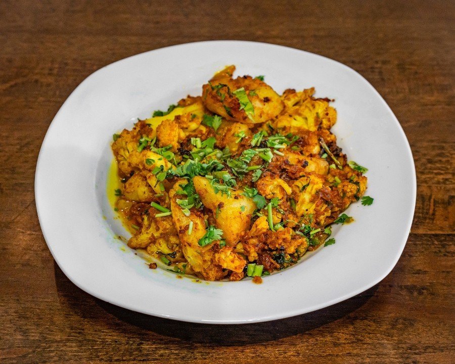 Authentic Halal Pakistani Party Tray featuring fresh herbs and traditional spices.